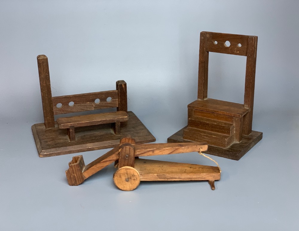 Naive scratch build wooden models of instruments of punishment