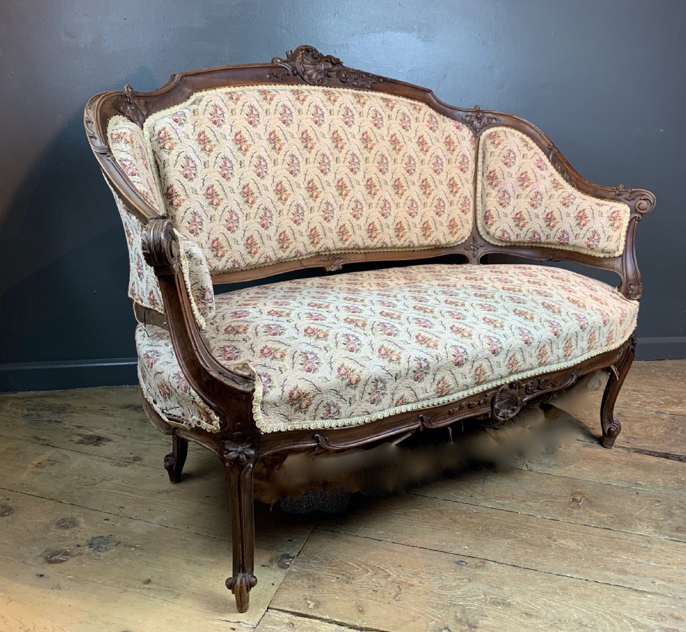 Antique French walnut two seat sofa in Louis XV style