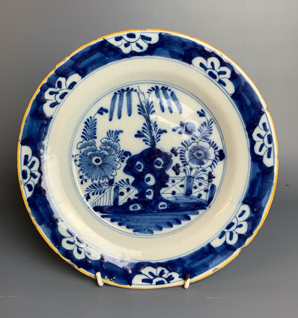 18th century Delft blue & white plate in an oriental fenced garden pattern
