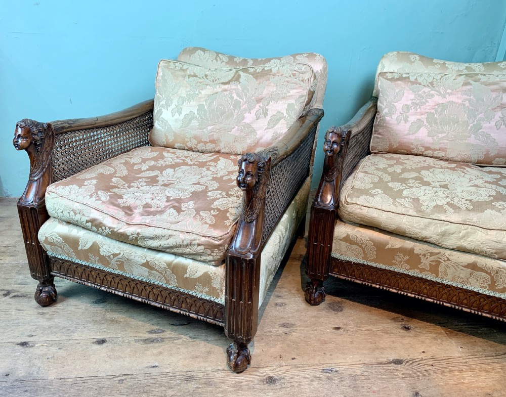 Pair of Edwardian double caned bergere armchairs with carved oak frames View IV