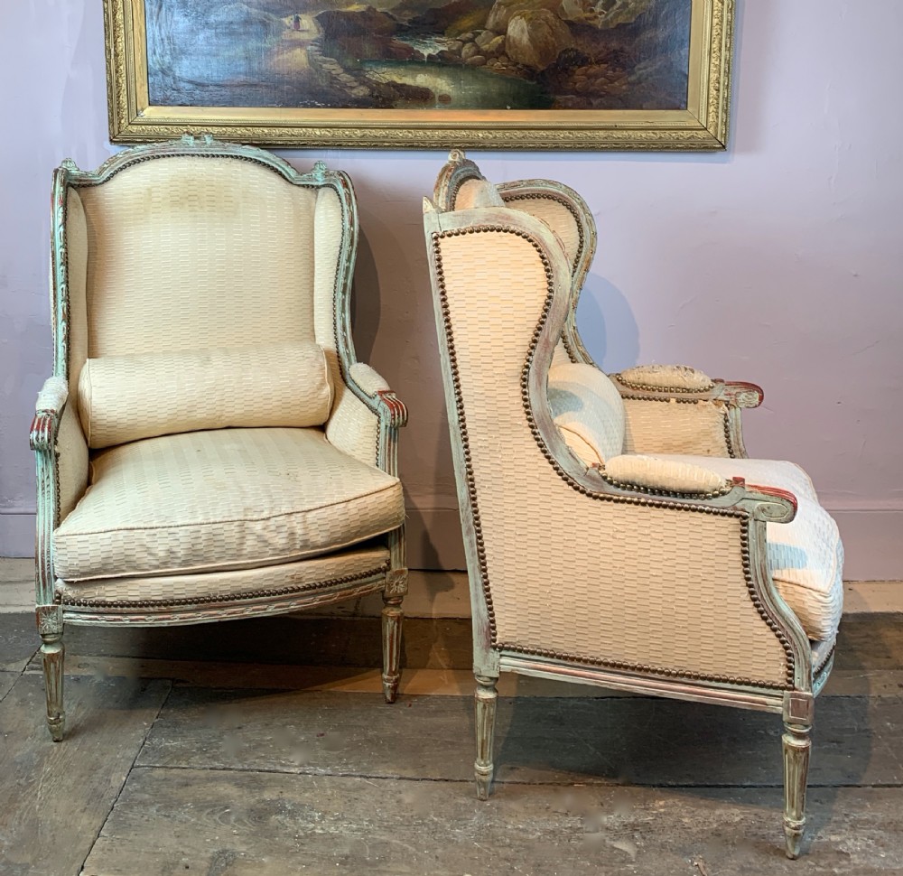 Pair of Antique French painted wing armchairs in Louis XVI style