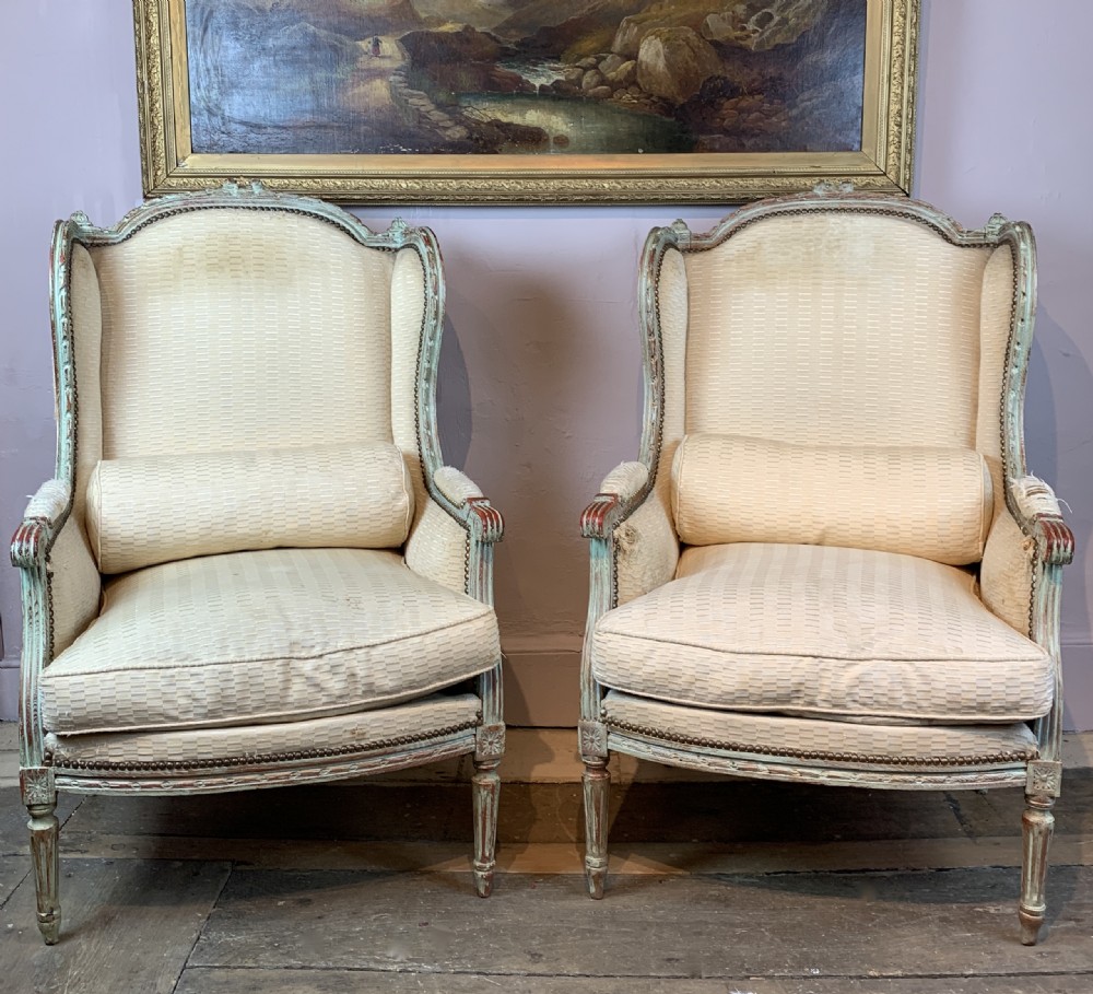 Pair of Antique French painted wing armchairs in Louis XVI style View II