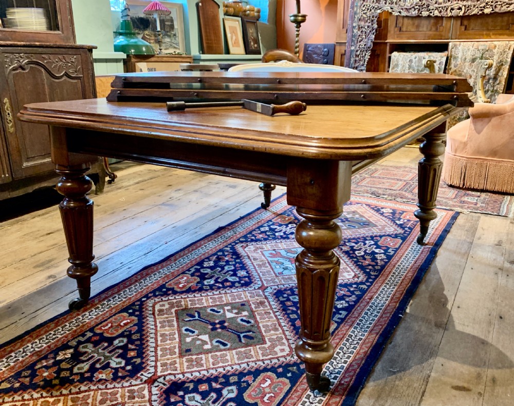 Victorian mahogany extending dining table with 2 additional leaves View II