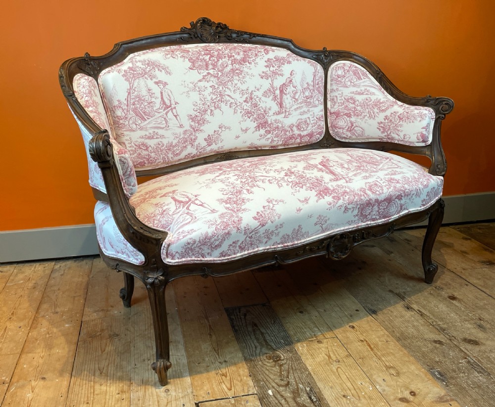 French Louis XV revival walnut sofa, newly upholstered in vintage toile de jouy