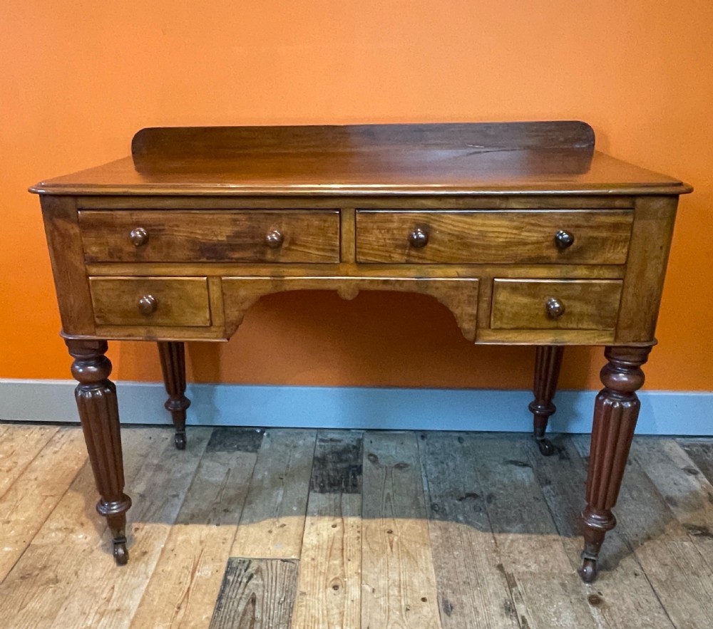 Early Victorian mahogany four drawer writing table View II