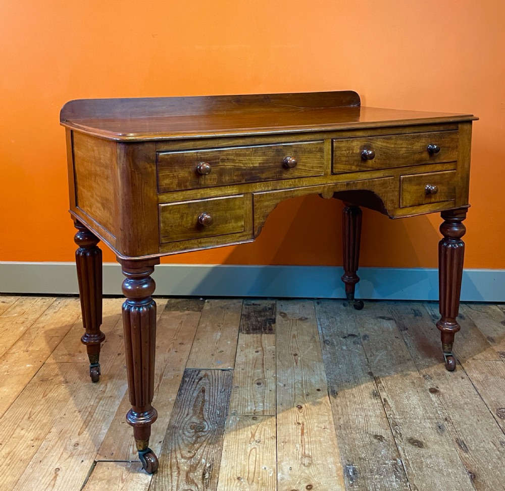 Early Victorian mahogany four drawer writing table View III