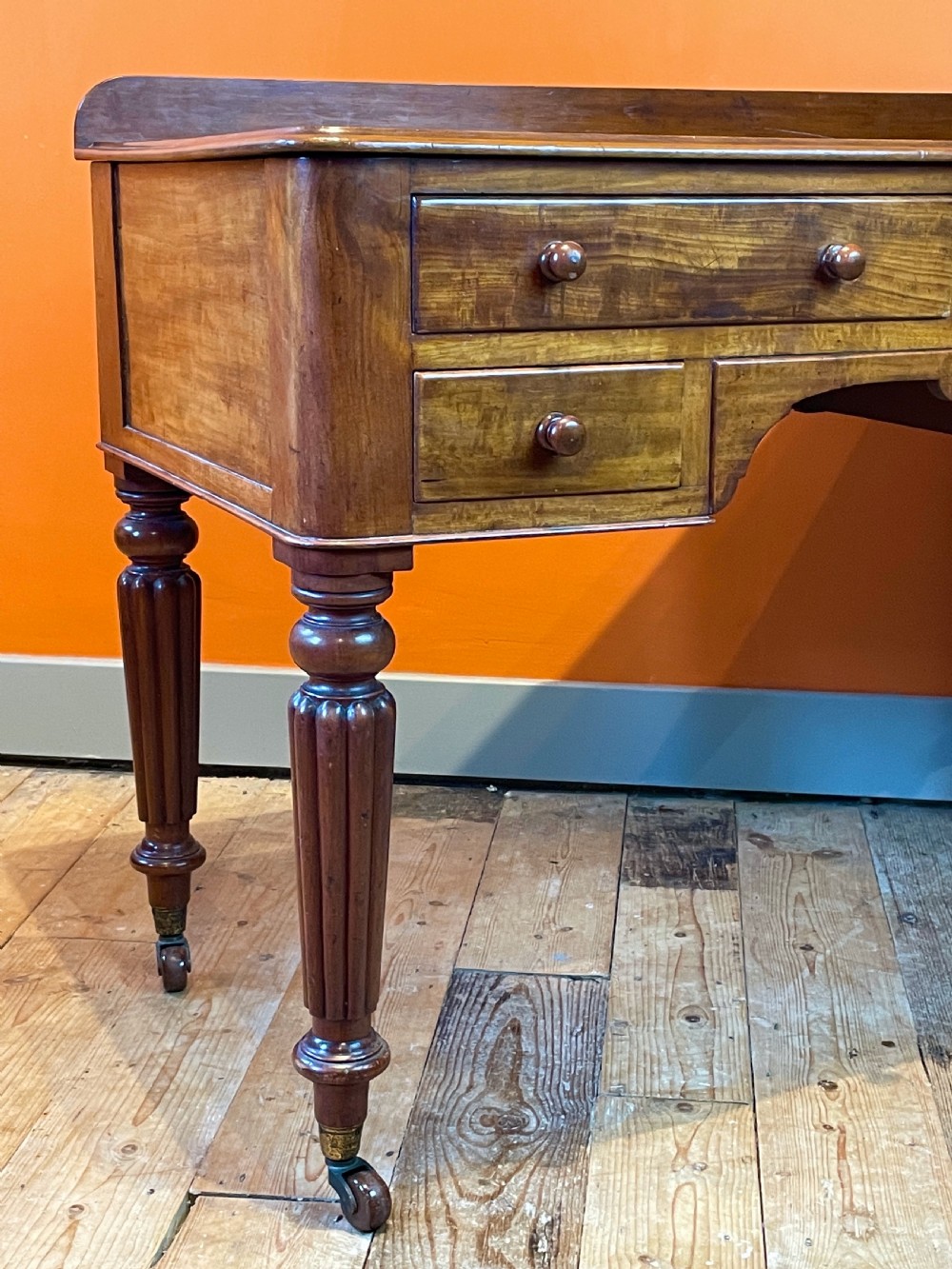 Early Victorian mahogany four drawer writing table View IV