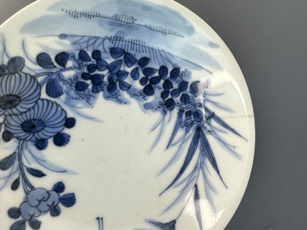 A 19th-century Japanese Hirado porcelain wine cup and matching saucer with cobalt blue underglaze hand-painted botanical motifs. View III