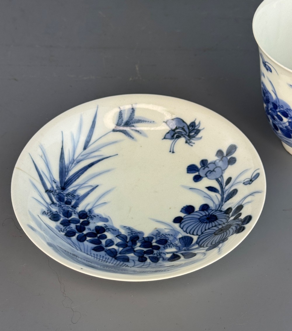 A 19th-century Japanese Hirado porcelain wine cup and matching saucer with cobalt blue underglaze hand-painted botanical motifs. View VIII