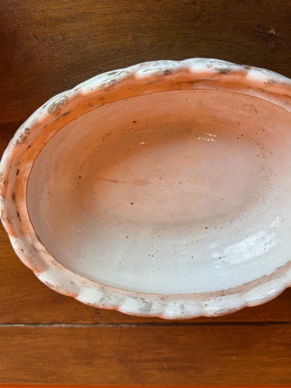 A Victorian Staffordshire Jackfield ceramic covered dish featuring a black glazed hen resting atop a white basketweave earthenware base. View IV