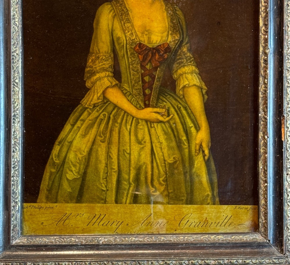 An 18th-century reverse glass mezzotint portrait depicting a woman in a yellow dress set within a dark moulded frame. View II