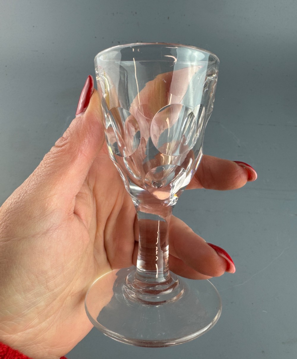 A clear Victorian deception glass featuring a thick-walled thumb-cut bowl, short stem, and circular foot. View IV