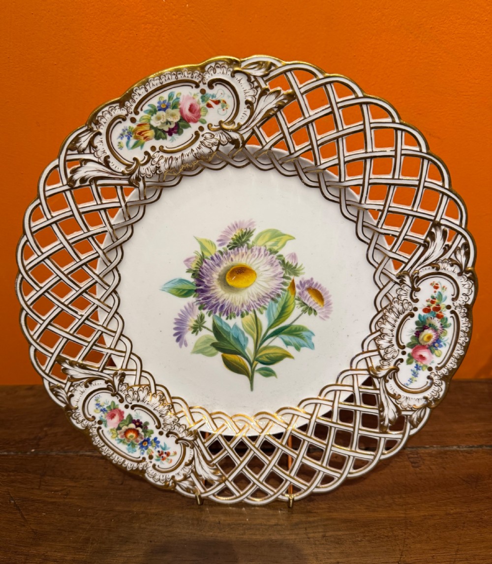 Pair of circular white porcelain plates with reticulated basketweave borders, gilded scrollwork, and hand-painted central botanical sprays. View IV