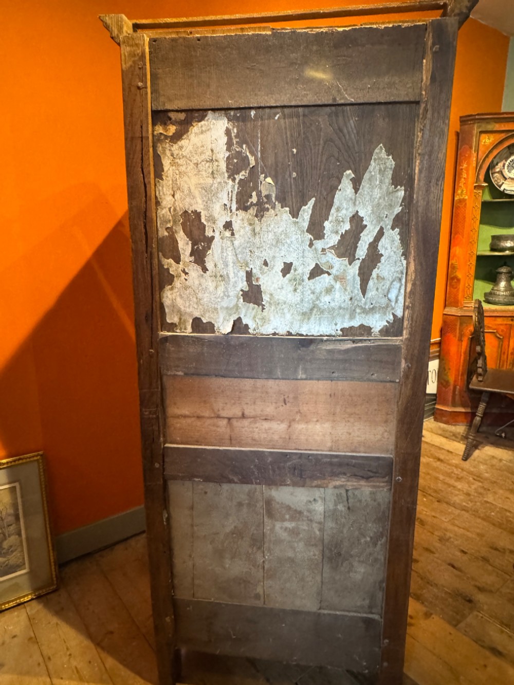 A 19th-century French oak bonnetiere featuring a single door with Louis XV style carved foliate mouldings, long iron hinges, and cabriole feet. View IX