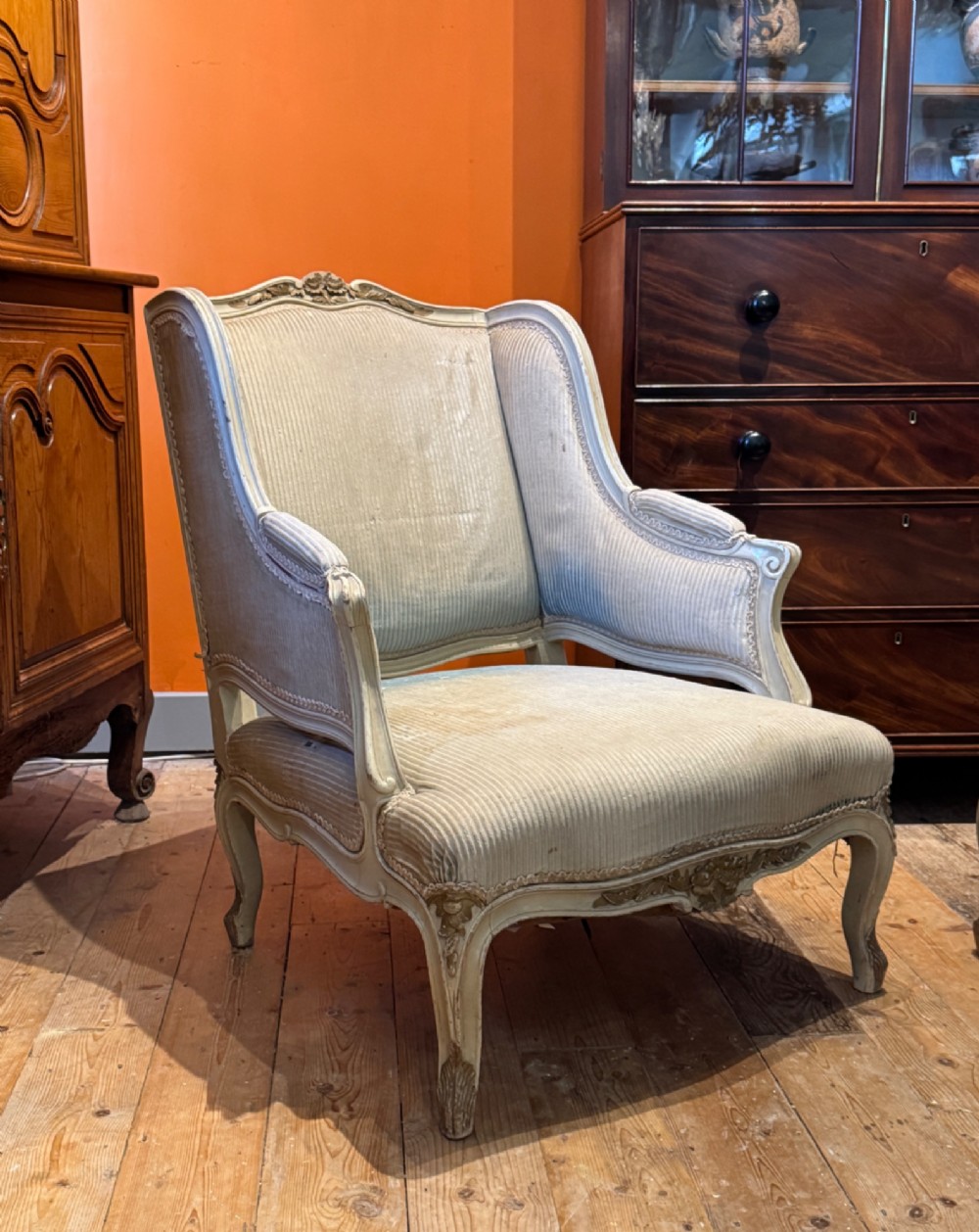 A French Louis XV style duchesse brisee comprising a painted armchair and matching footstool with cabriole legs and neutral upholstery. View III