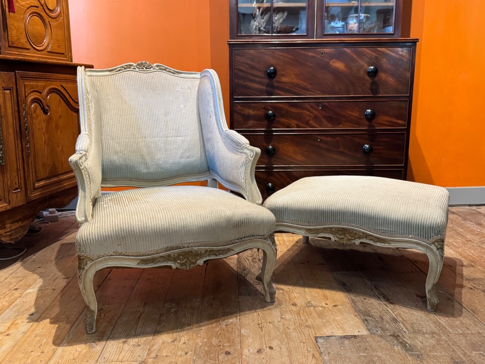 A French Louis XV style duchesse brisee comprising a painted armchair and matching footstool with cabriole legs and neutral upholstery. View VI