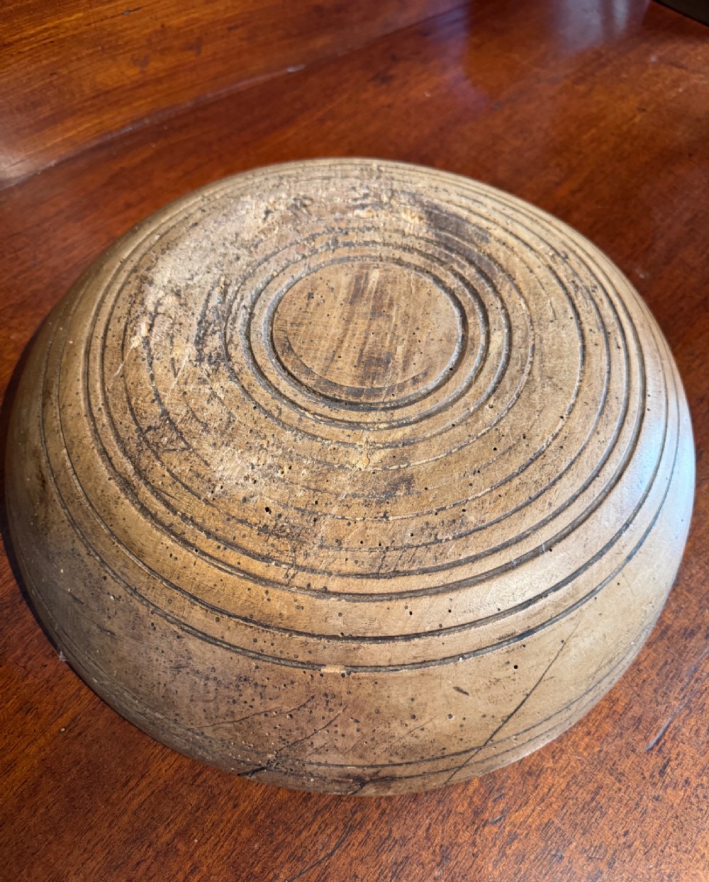 A shallow 19th-century French hand-turned sycamore dairy bowl featuring incised concentric rim lines and natural wood patination. View III