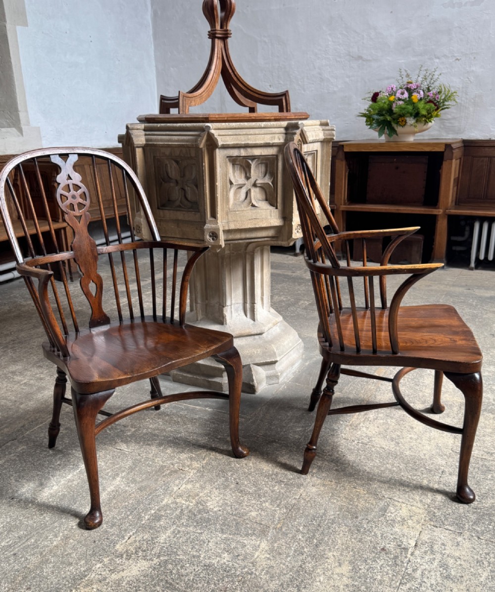 A set of six antique ash and beech Windsor chairs featuring arched backs with wheelback splats, shaped solid seats, and front cabriole legs. View VII