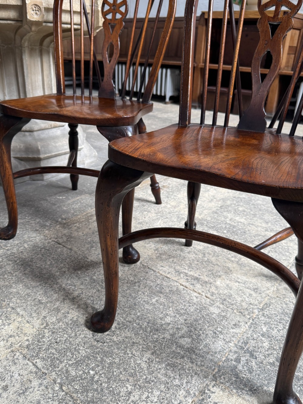 A set of six antique ash and beech Windsor chairs featuring arched backs with wheelback splats, shaped solid seats, and front cabriole legs. View XI
