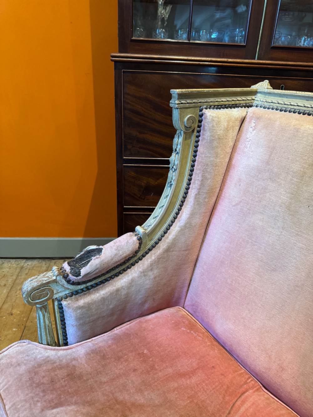 An antique Louis XVI French bergere armchair with a grey painted carved wood frame and dusty pink velvet upholstery. View III
