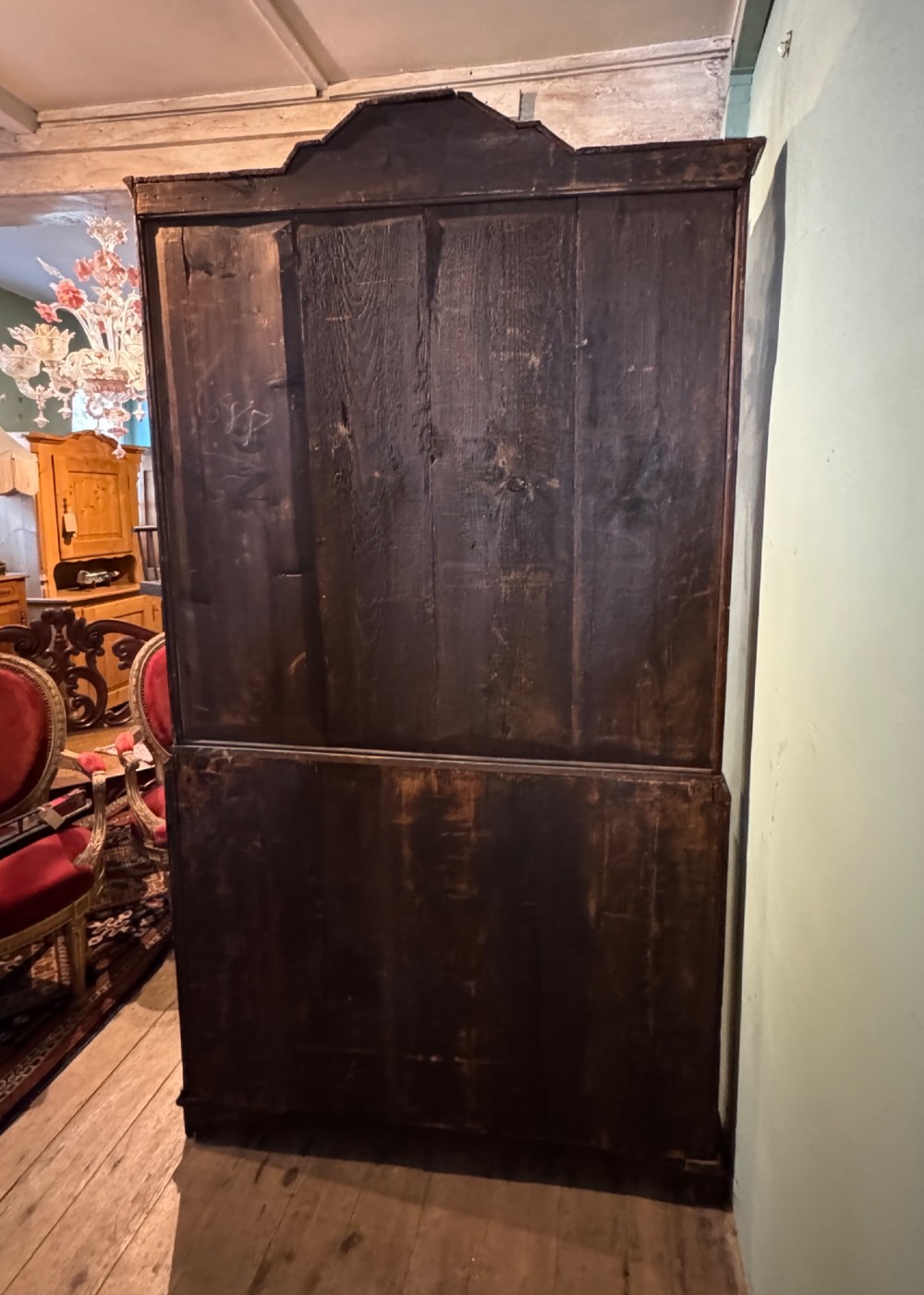 An antique Dutch walnut display cabinet featuring intricate floral marquetry inlays, glazed upper doors, and a double cupboard lower section supported by bun feet. View XIII