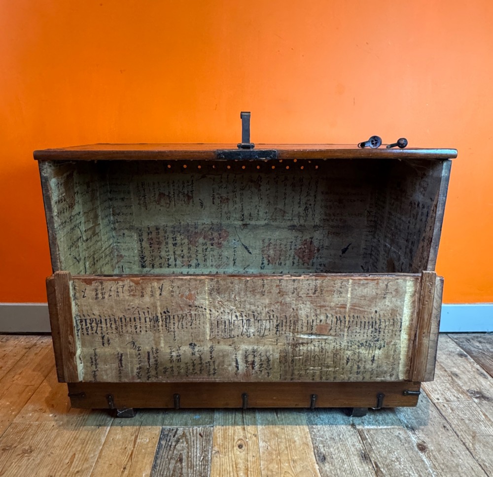 An antique wooden Korean Bandaji chest fitted with black iron strap hinges, decorative round bosses, and drop handles. View VI