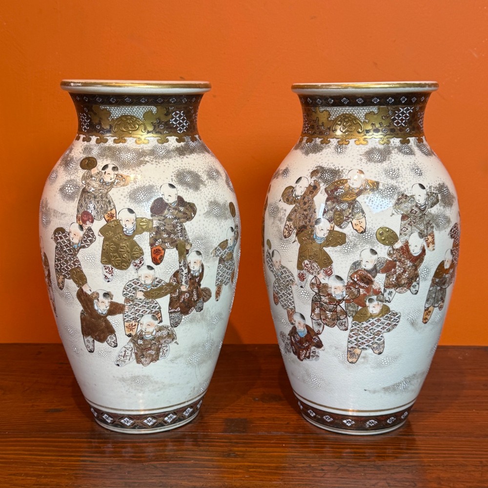 A pair of baluster-shaped Japanese Satsuma earthenware vases featuring hand-painted figures in the Hundred Boys pattern with gilded borders and a crackle glaze. View III