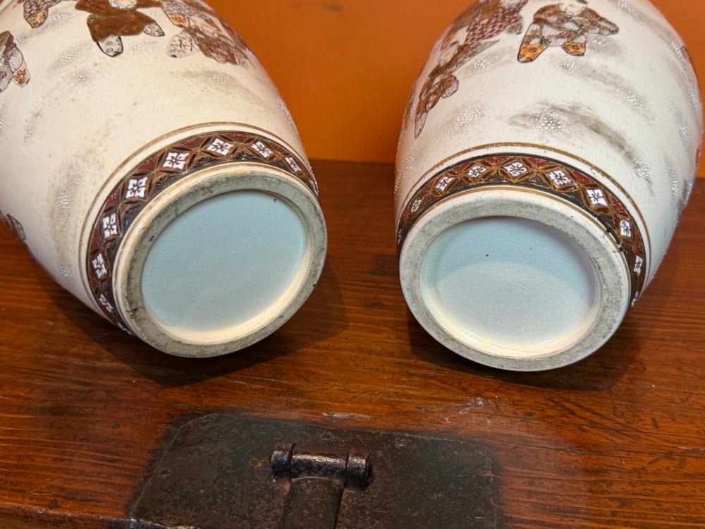 A pair of baluster-shaped Japanese Satsuma earthenware vases featuring hand-painted figures in the Hundred Boys pattern with gilded borders and a crackle glaze. View IV