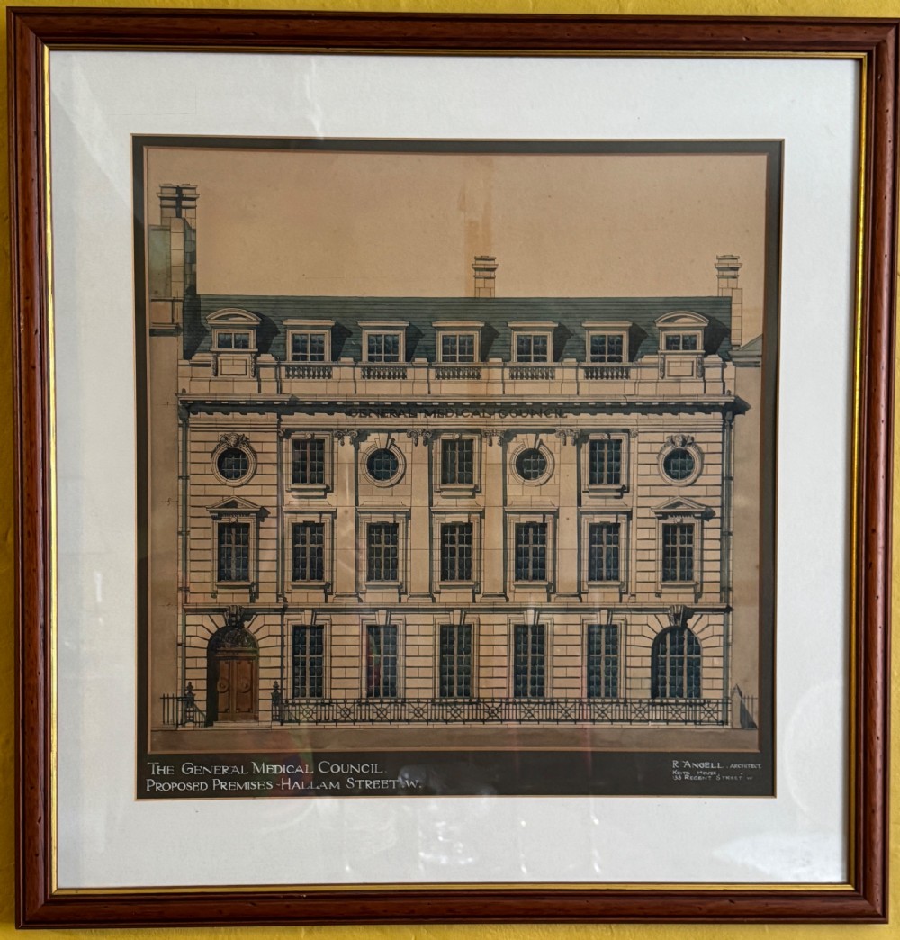 A framed architectural watercolour drawing depicting the front elevation of a Classical-style building with detailed windows and a formal title block.