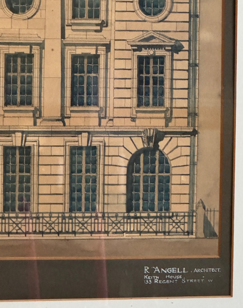 A framed architectural watercolour drawing depicting the front elevation of a Classical-style building with detailed windows and a formal title block. View IV