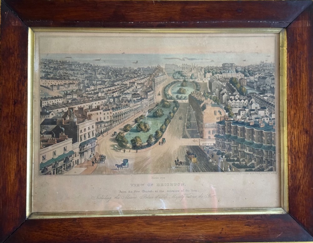 A framed nineteenth-century aquatint depicting an aerial view of Brighton, presented in a dark wooden frame with a gilded inner slip. View II