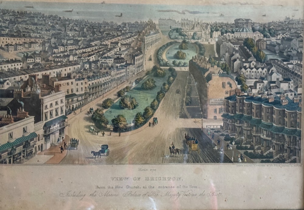 A framed nineteenth-century aquatint depicting an aerial view of Brighton, presented in a dark wooden frame with a gilded inner slip. View III