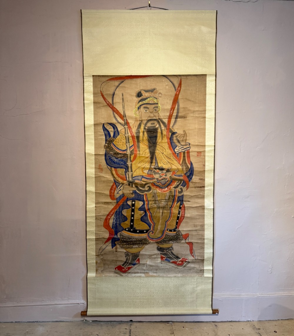 A nineteenth-century Chinese hanging scroll depicting the armoured Daoist deity Yuchi Gong mounted on light gold silk background fabric.
