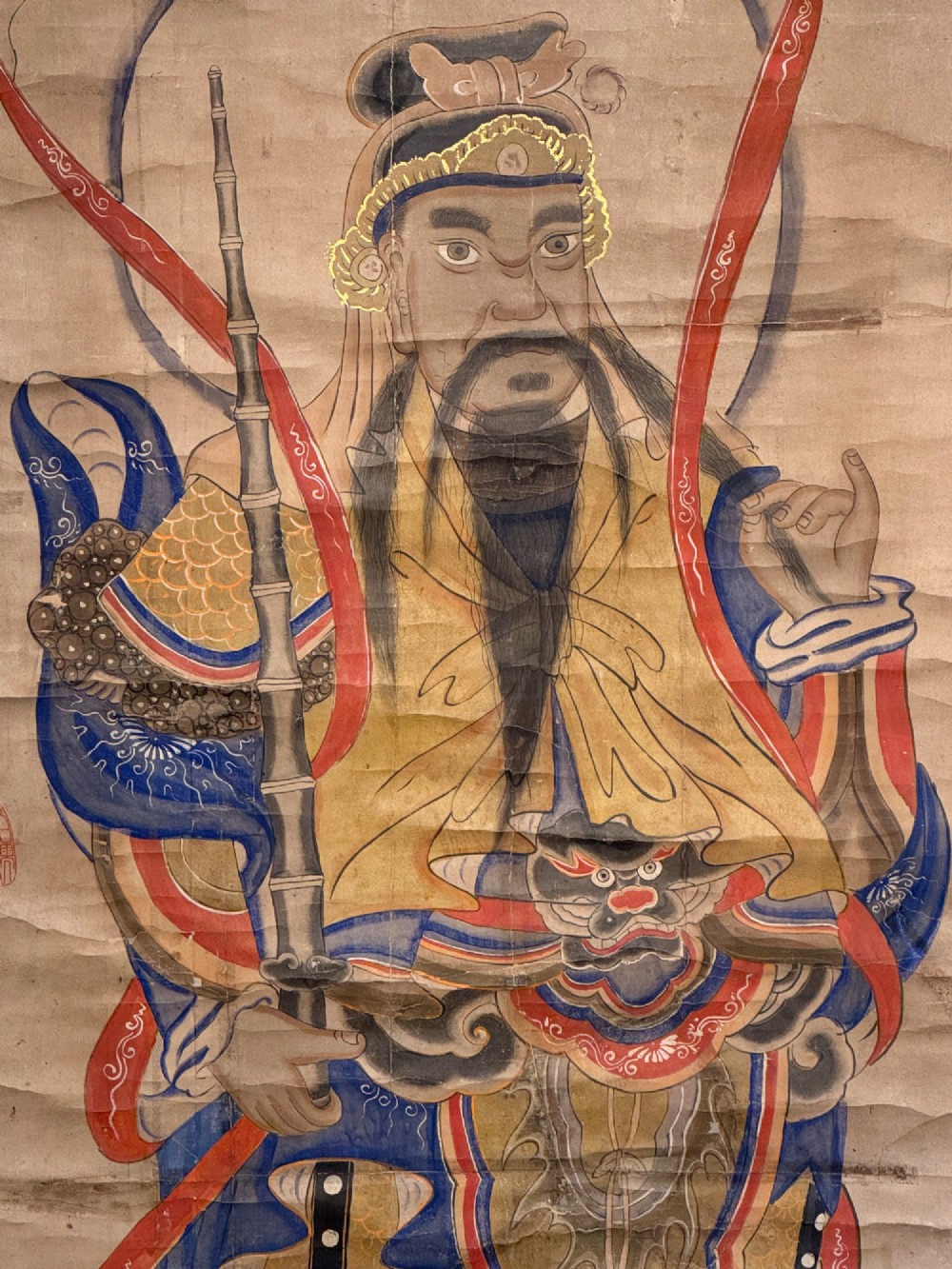 A nineteenth-century Chinese hanging scroll depicting the armoured Daoist deity Yuchi Gong mounted on light gold silk background fabric. View III