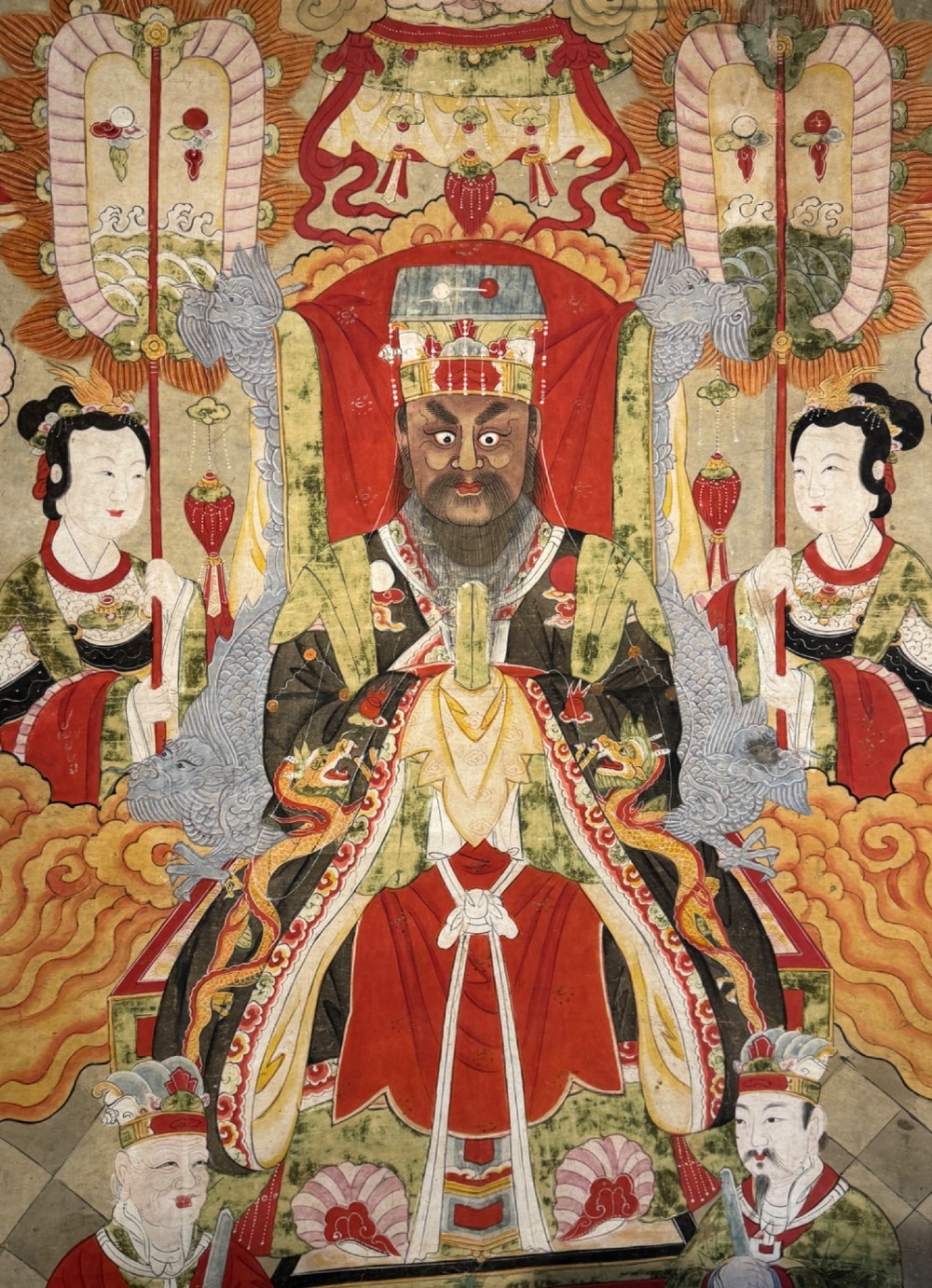 A vertical 19th-century Chinese hanging scroll painting on a pale silk mount depicting an enthroned Daoist judge surrounded by court attendants and mythological figures in red and green ceremonial robes. View III