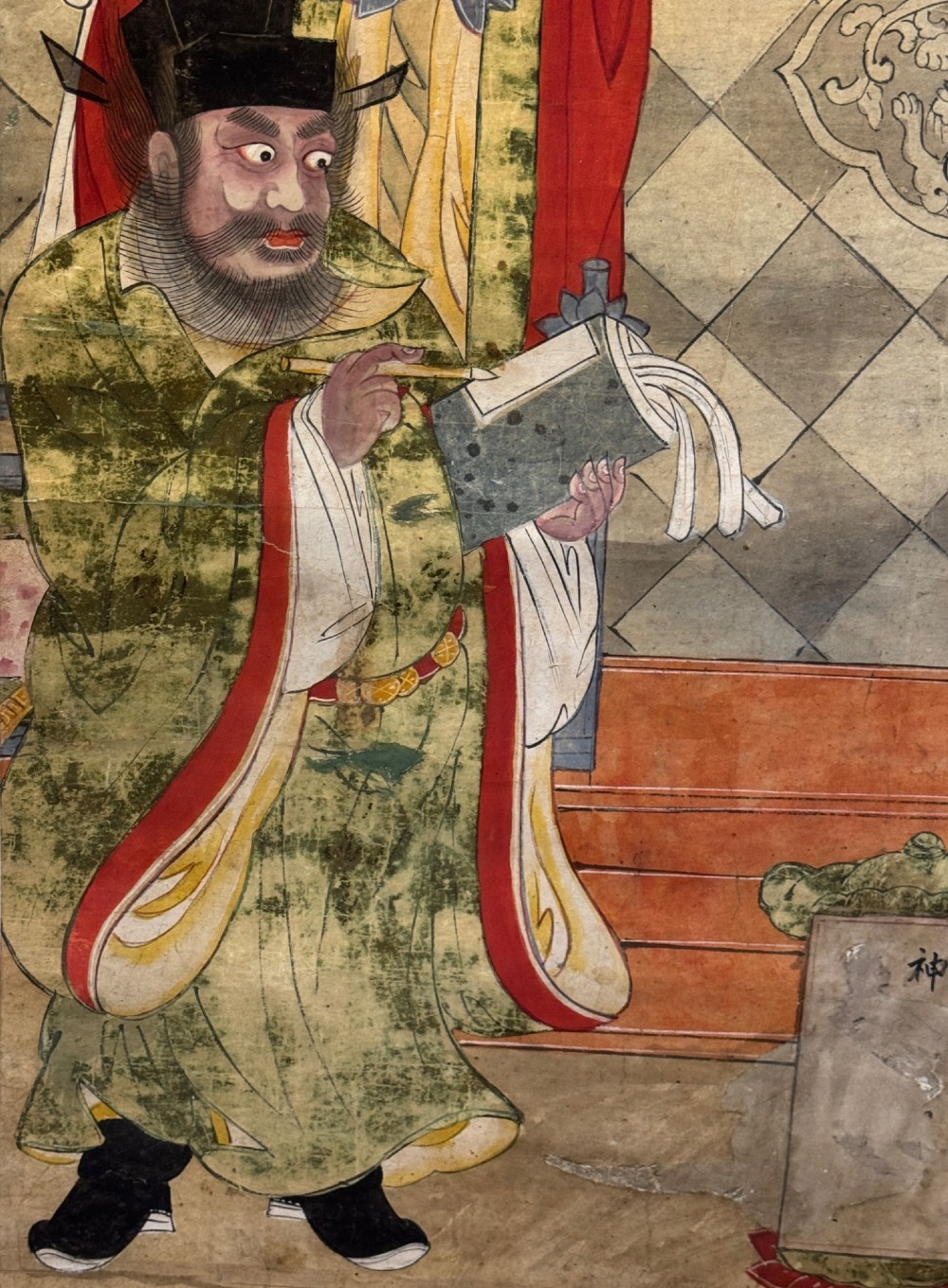 A vertical 19th-century Chinese hanging scroll painting on a pale silk mount depicting an enthroned Daoist judge surrounded by court attendants and mythological figures in red and green ceremonial robes. View VII