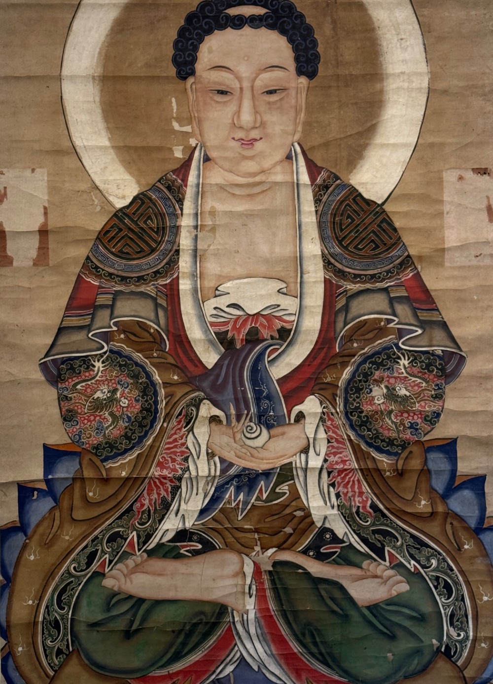 A 19th-century Chinese hanging scroll depicting Buddha Shakyamuni seated on a lotus throne painted in mineral pigments with silk mounting. View IV