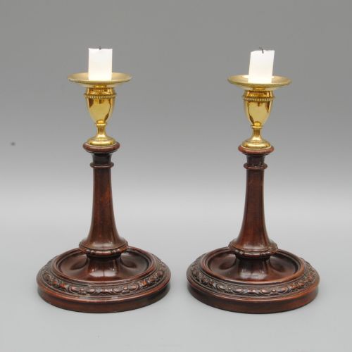 A Pair of 18th Century Mahogany and Brass Candlesticks