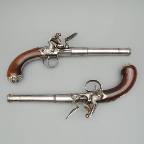 A Rare Pair of Silver Mounted Queen Anne Pistols