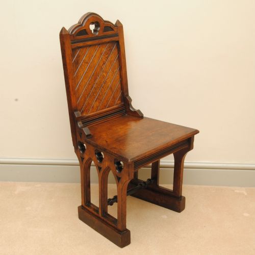 A PAIR OF 19TH CENTURY GOTHIC DESIGN PITCH PINE HALL CHAIRS - ADDITIONAL PHOTO 1