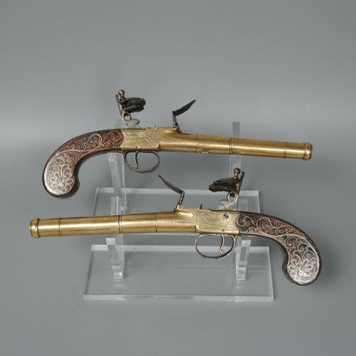 A Fine Pair of Silver Inlaid Brass Barrelled Pistols by Bunney London