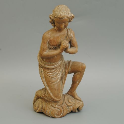 A Carved Continental Figure of a Kneeling Saint