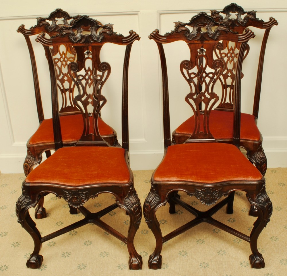 A set of four carved rosewood cabriole leg Portuguese chairs