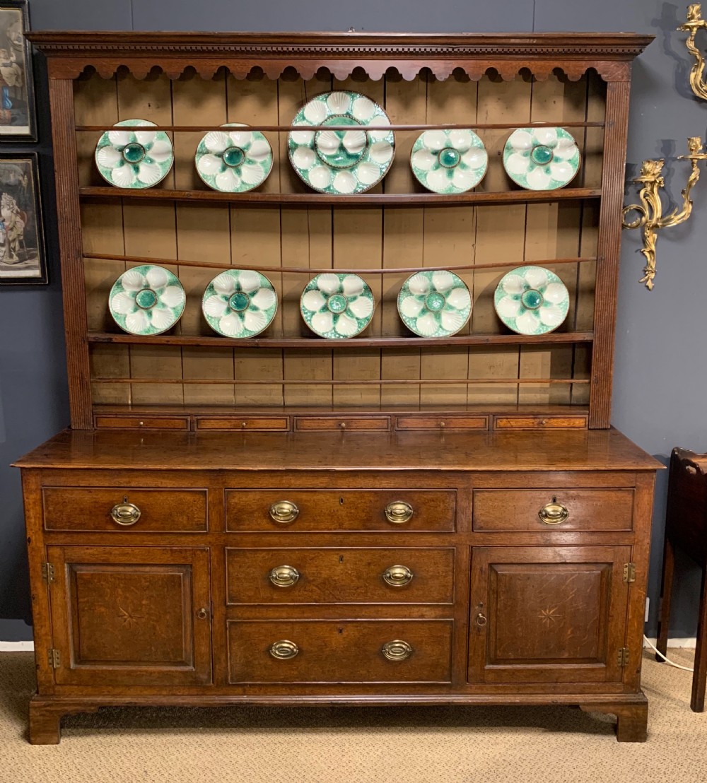 A good late 18th century oak dresser and original rack