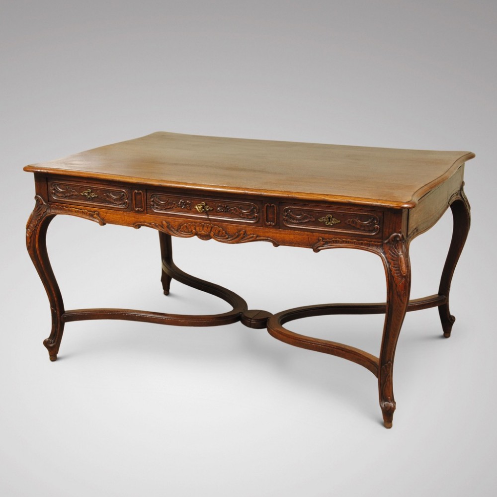 19TH CENTURY FRENCH CARVED OAK WRITING TABLE