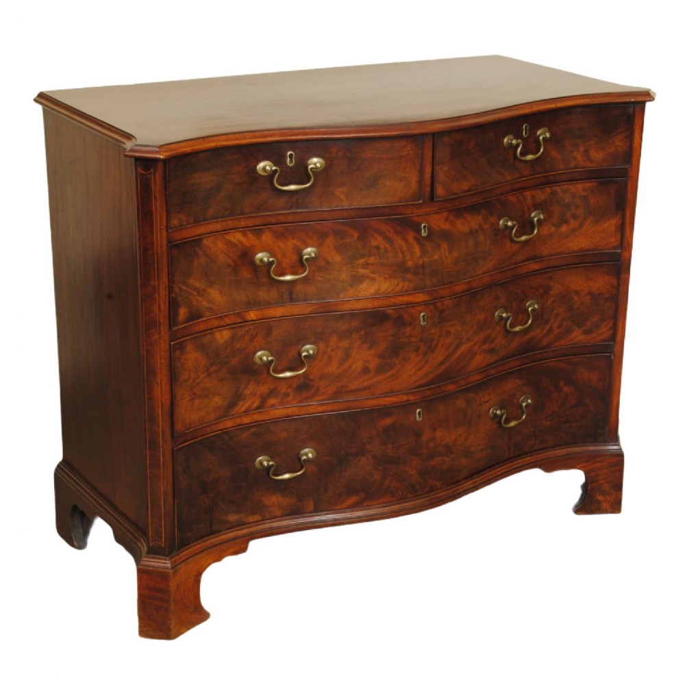 A GEORGE III PERIOD MAHOGANY SERPENTINE CHEST