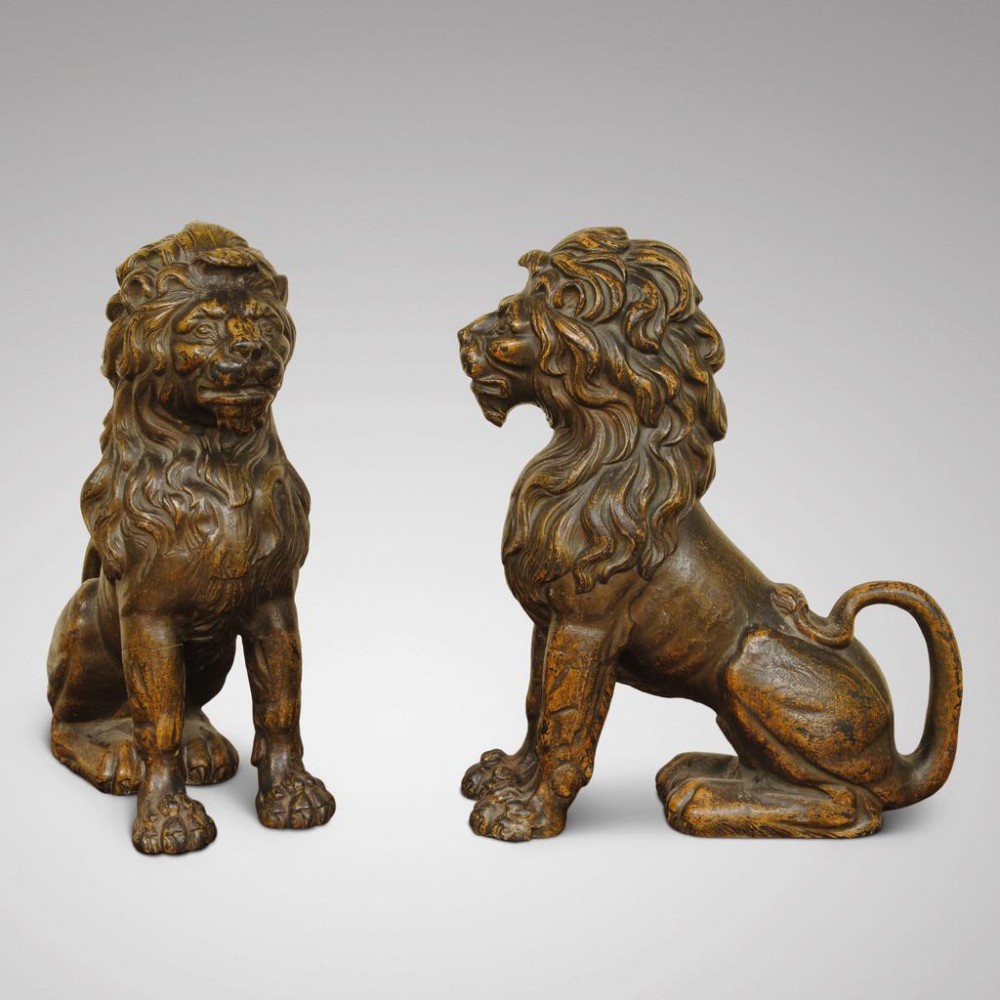 A SUPER PAIR OF PATINATED CAST IRON LIONS