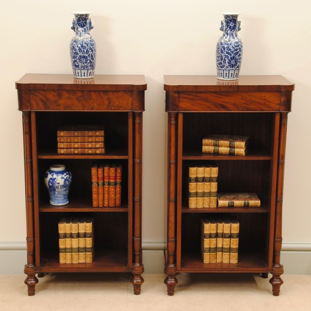 A CHARMING PAIR OF REGENCY OPEN BOOKCASES