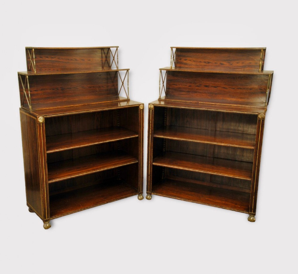 A SMART PAIR OF REGENCY SIMULATED ROSEWOOD OPEN BOOKCASES