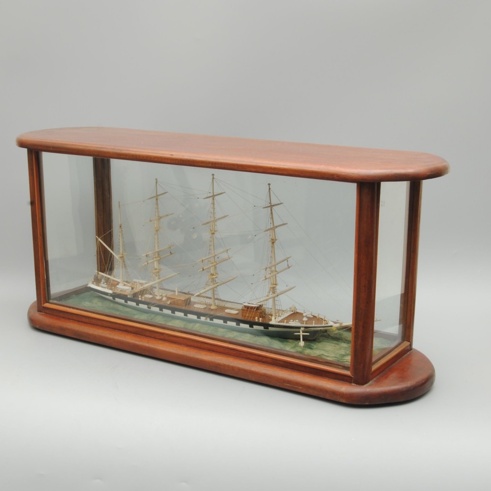 A 19TH CENTURY SAILOR WORK BONE MODEL OF A FOUR MASTED SCHOONER NAMED PEGGY